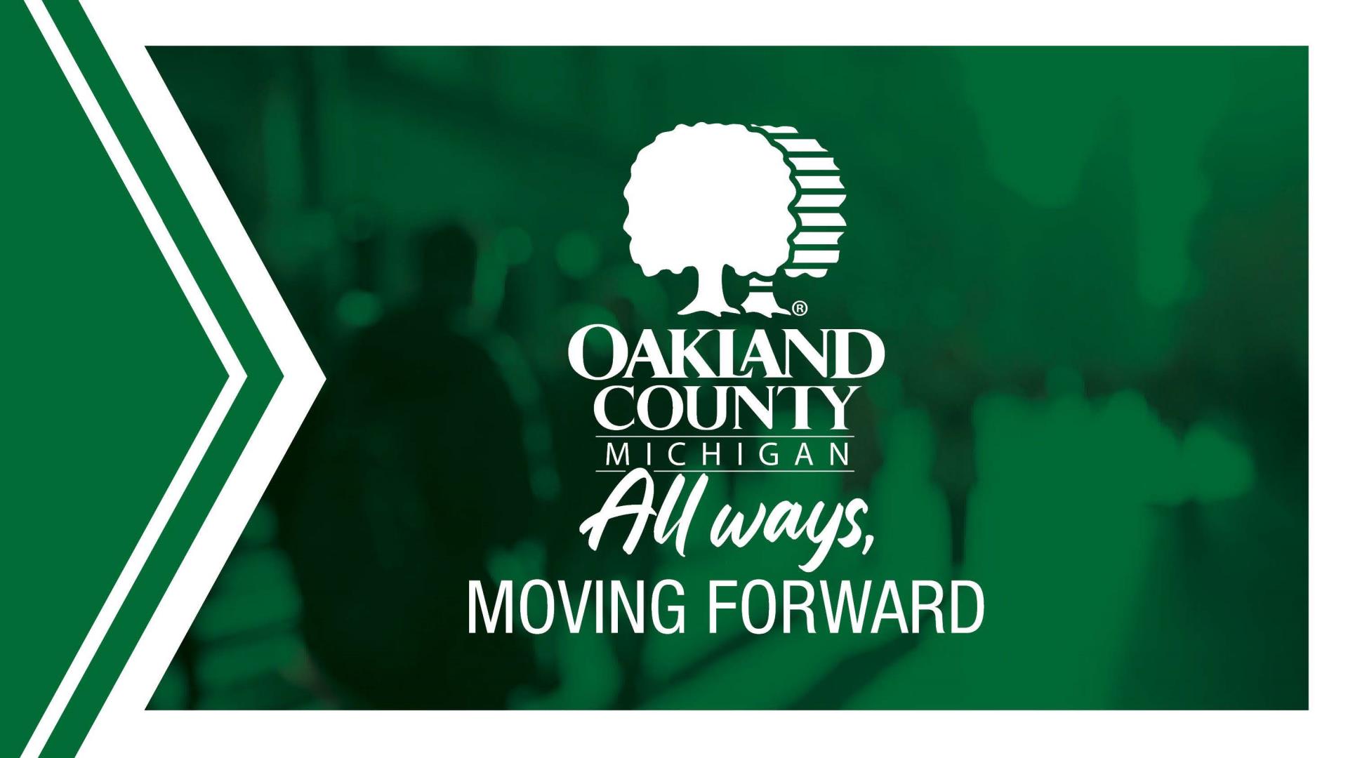 A green and white Oakland County-branded graphic features the county slogan 