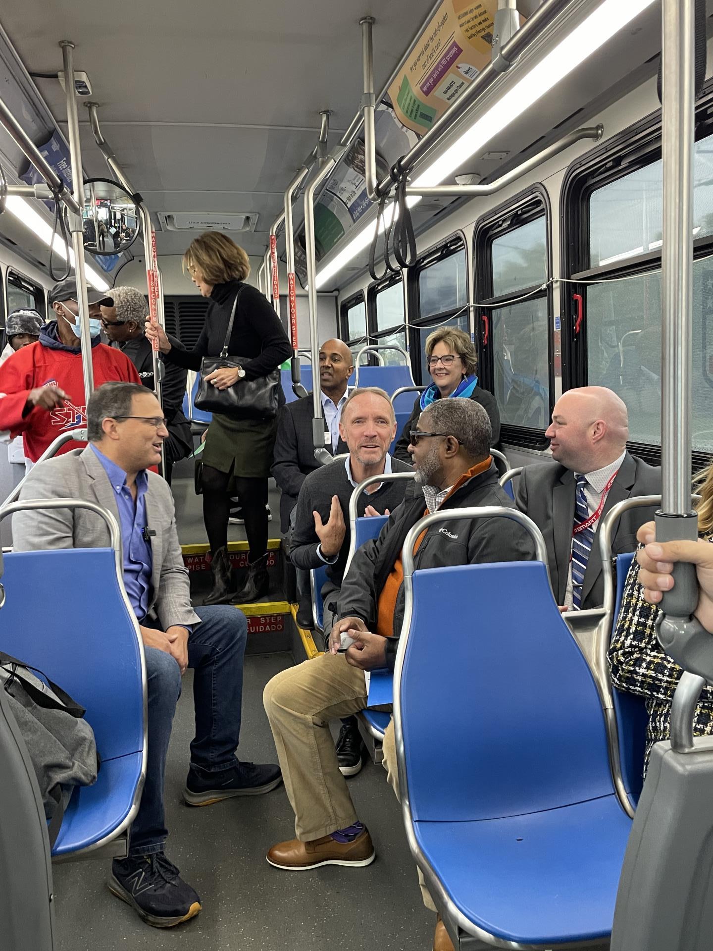 Oakland County Executive Coulter speaks with Oakland County Board of Commissioners Chairman David T. Woodward; SMART Vice President of External Affairs Bernard Parker III; and SMART Vice President of Paratransit and On-Demand Services Daniel Whitehouse.