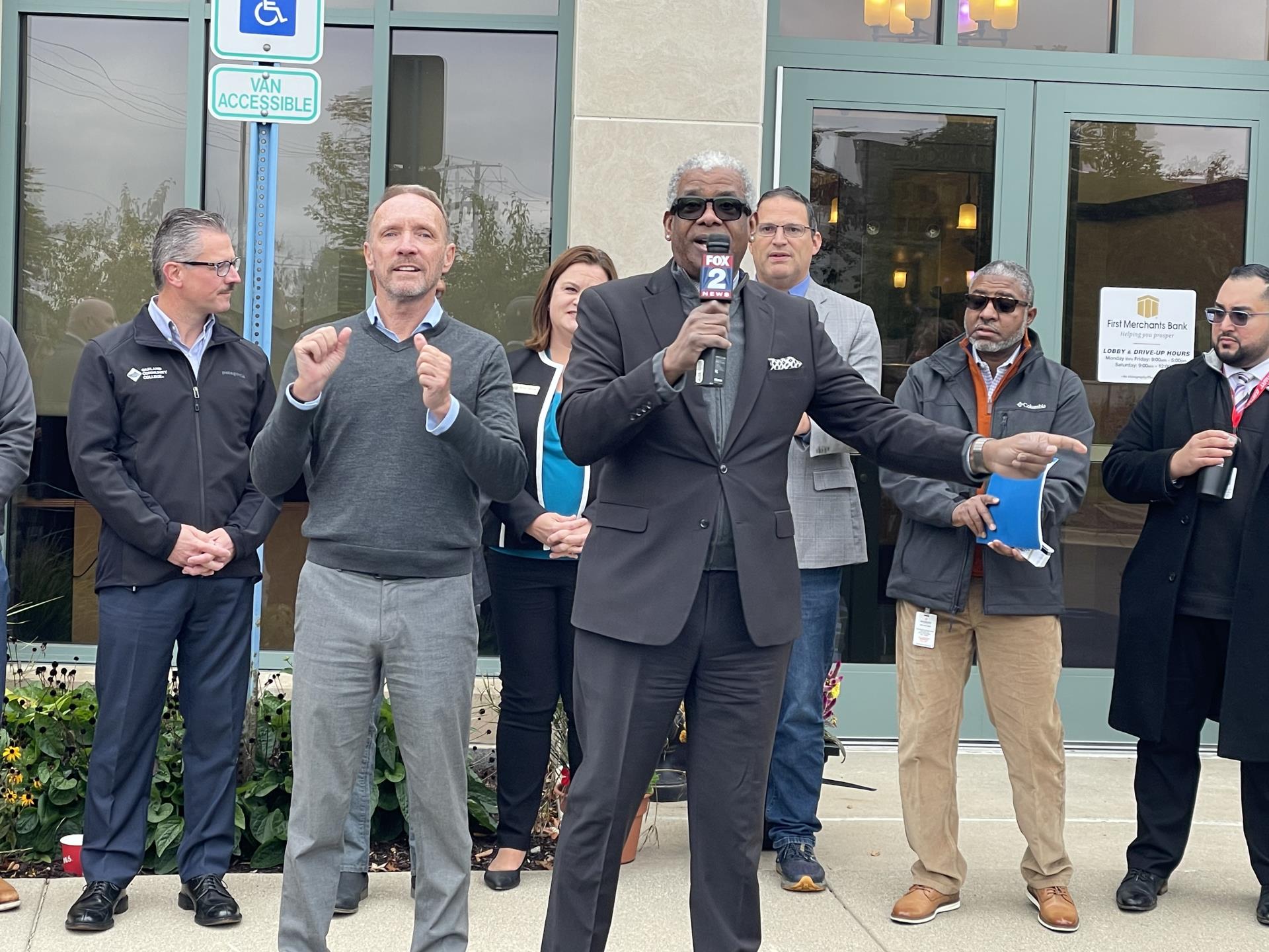 SMART General Manager Dwight Ferrell speaks to media with Oakland County Executive Dave Coulter in front of First Merchants Bank in Novi.