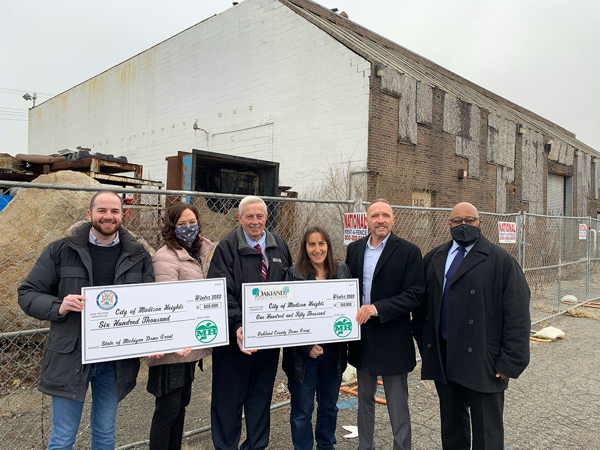 Commissioner Gary R. McGillivray with elected officials at a Madison Heights demolition site of an electro-plating plant