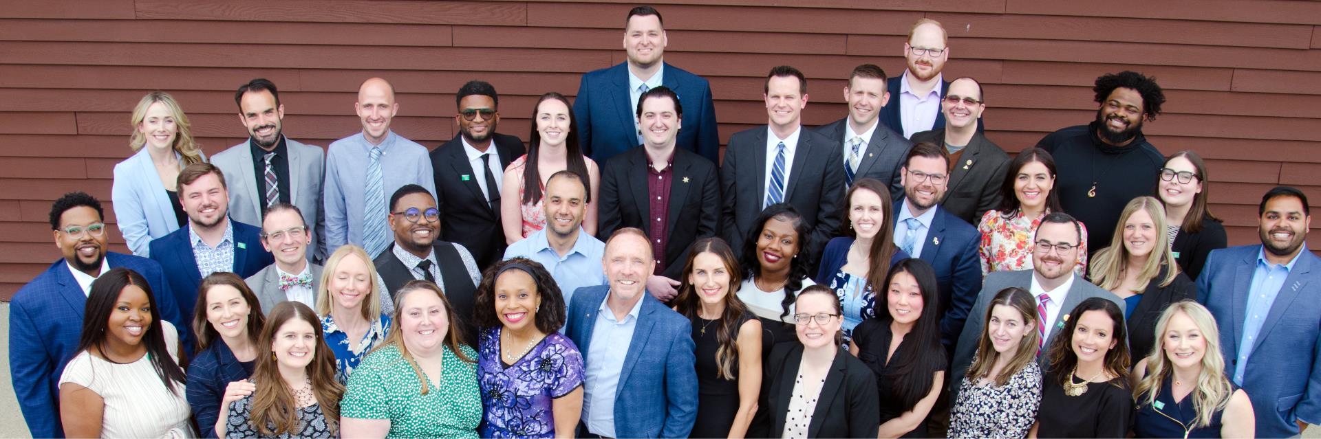 Group photo of the 2023 class members of the 40 Under 40 program with County Executive Dave Coulter in the middle