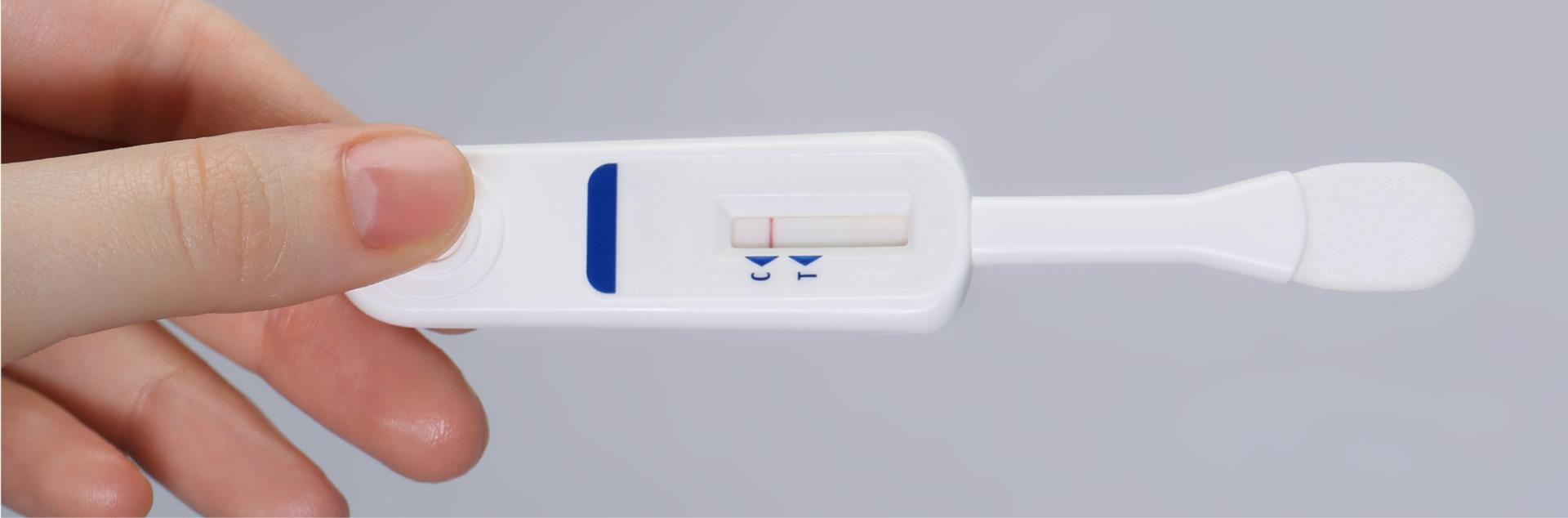 Hand holding a rapid HIV test