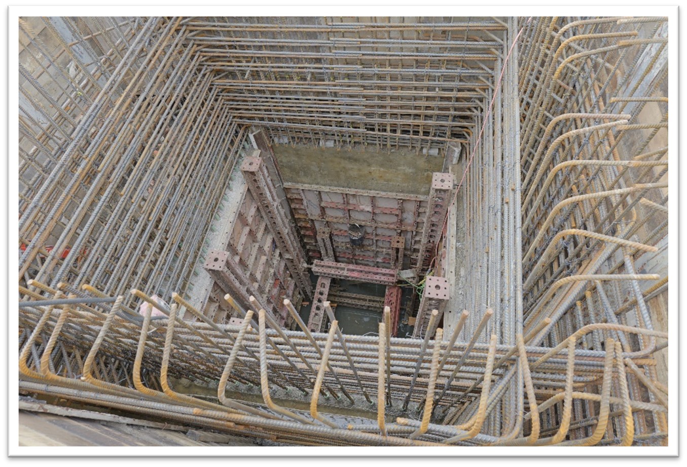 Steel reinforcement and formwork being installed in preparation for a wall of concrete to be poured for the control structure.