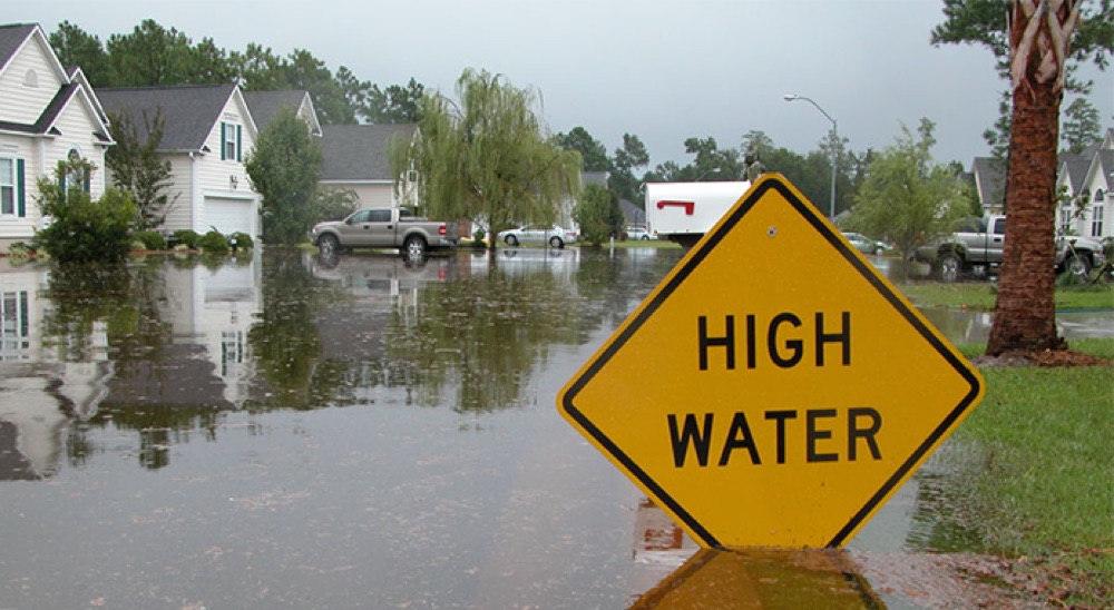 high water sign in a flood scene