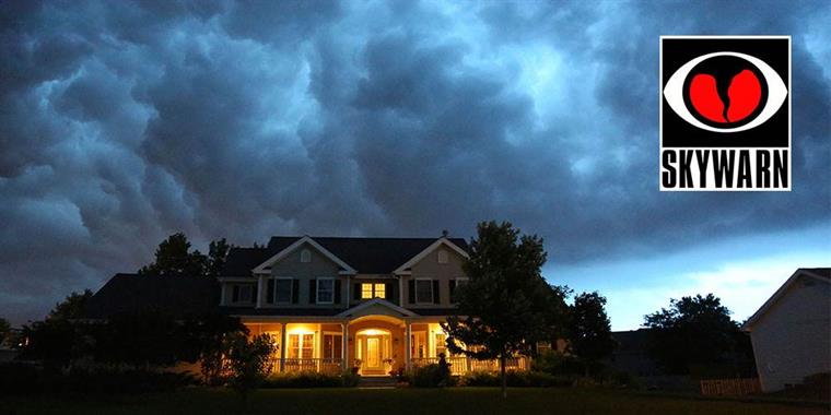 ominous clouds over a house at night