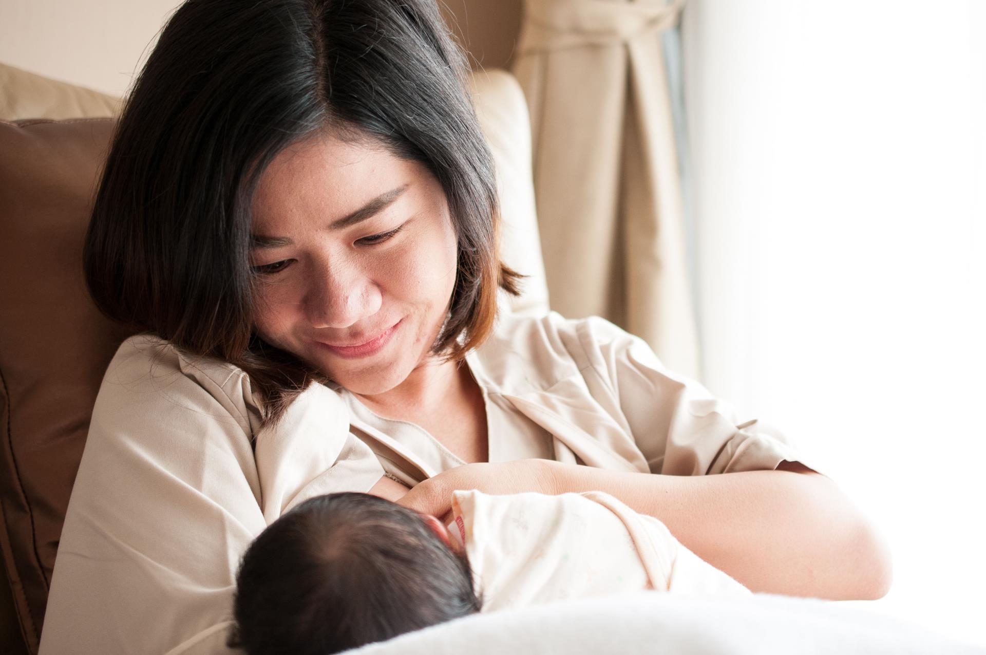 Woman breastfeeding baby