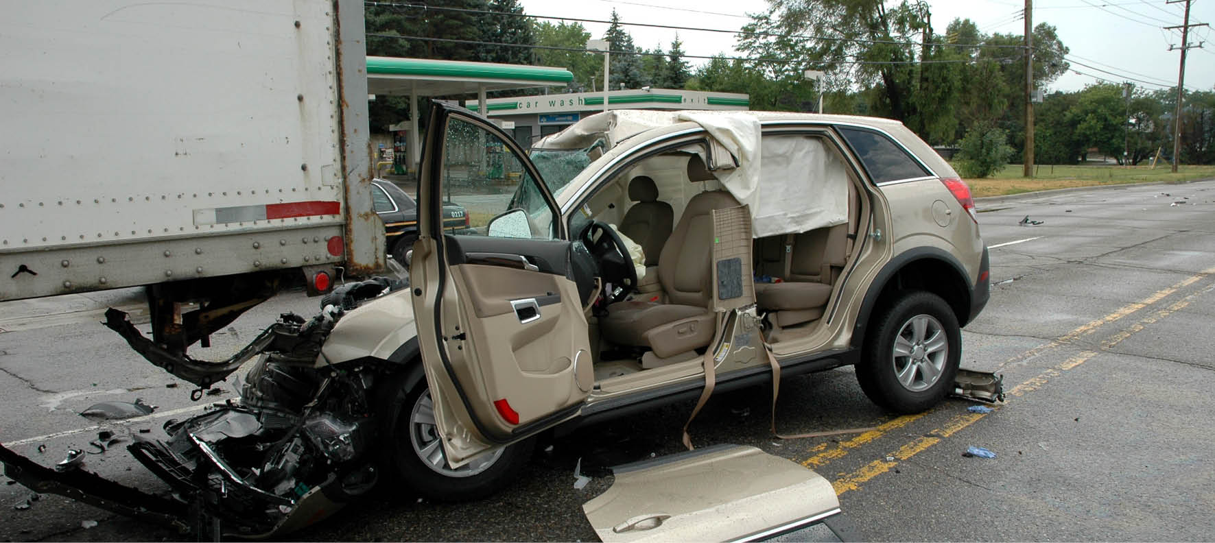 Wrecked SUV crashed into truck trailer