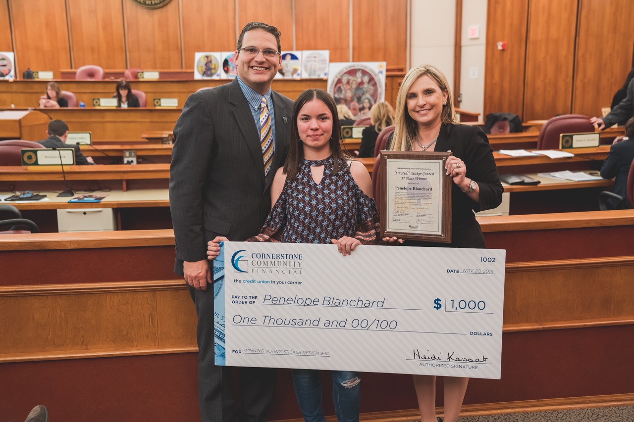 1st place contest winner (9-12th grade category) Penelope Blanchard (9th grade) from Walled Lake Western High School with Dave Woodward and Heidi Kassab.