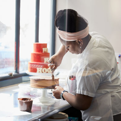 Keona frosting a cake