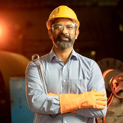 Paramjit wearing hard hat and safety glasses