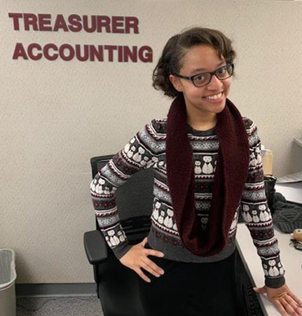 Nicole at her desk