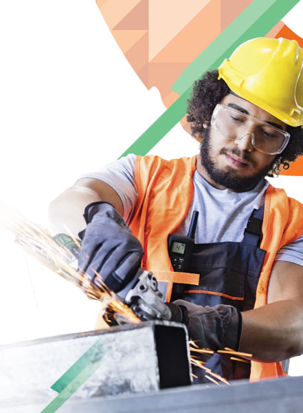 Worker using metal grinder