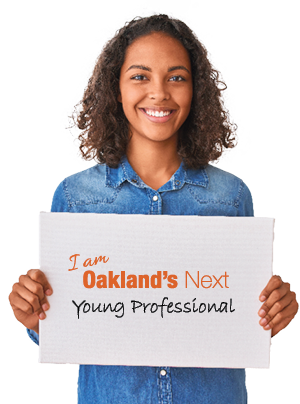 Person holding sign reading I am Oakland's Next Young Professional