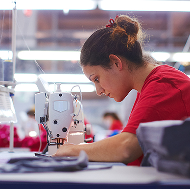 Worker using sewing machine